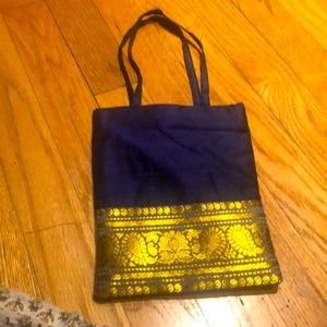 Small evening silk bag with golden border very light weight